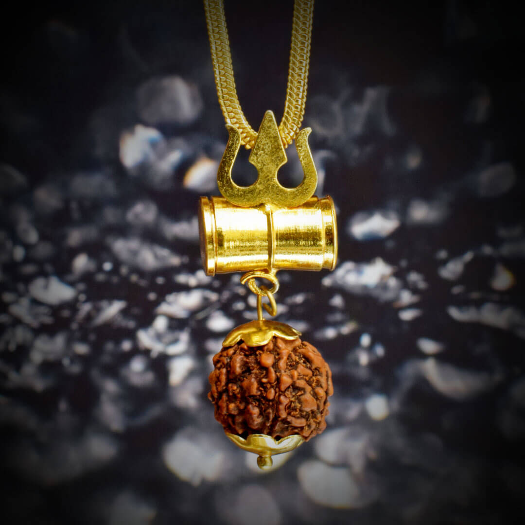 A square Mahakal Kavach locket with angles hanging in front of a black stone as shown in this image